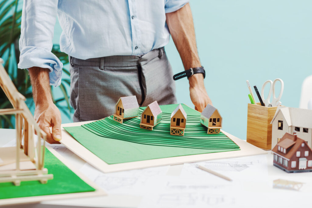 an-architect-shows-the-model-of-his-project-2025-01-08-11-42-14-utc-scaled